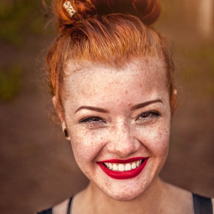 Kaveri Mehta, Lead Design Curator at Forest Bridge Hub, reviewing corporate floral arrangements